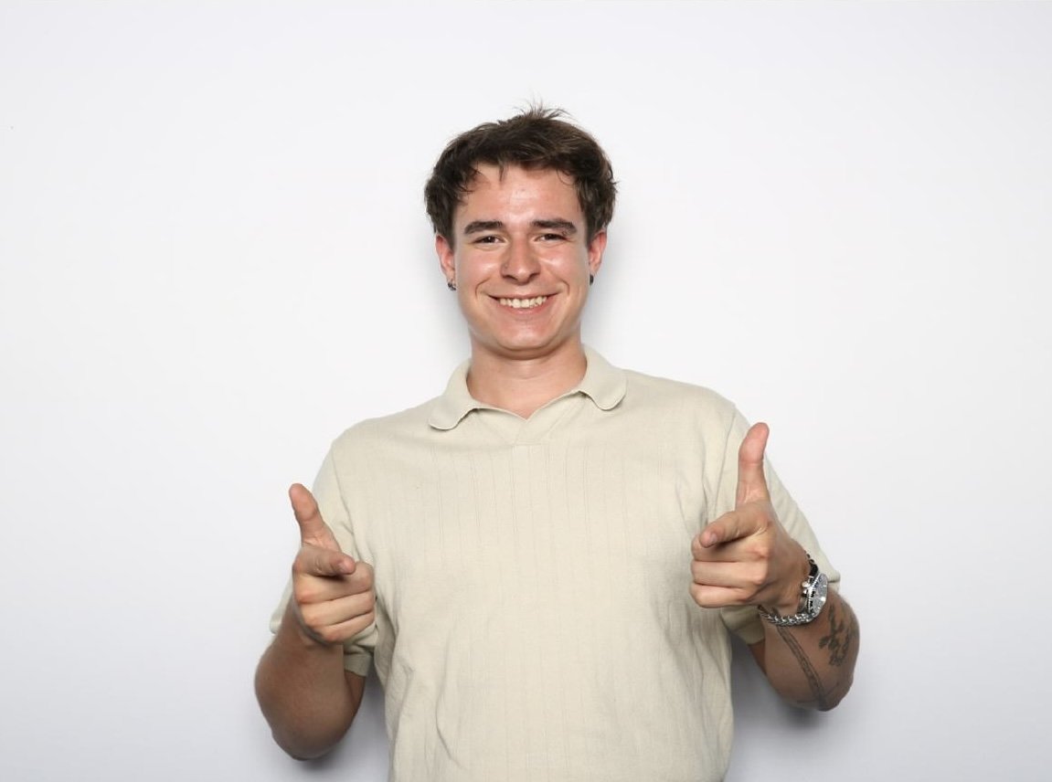 Liam RoamN smiling and pointing at the camera